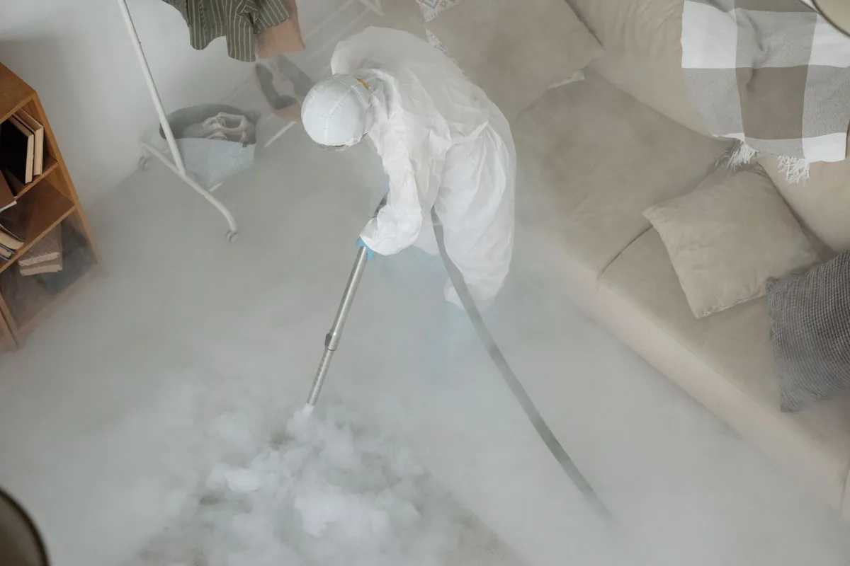 Biohazard cleanup technician in protective equipment, Hartford, AL